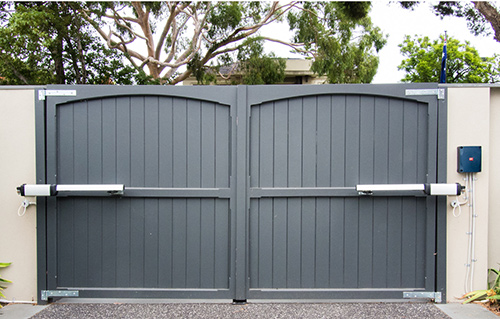 Wooden Gates on Brick Wall with BFT Phobos automatic gate motors